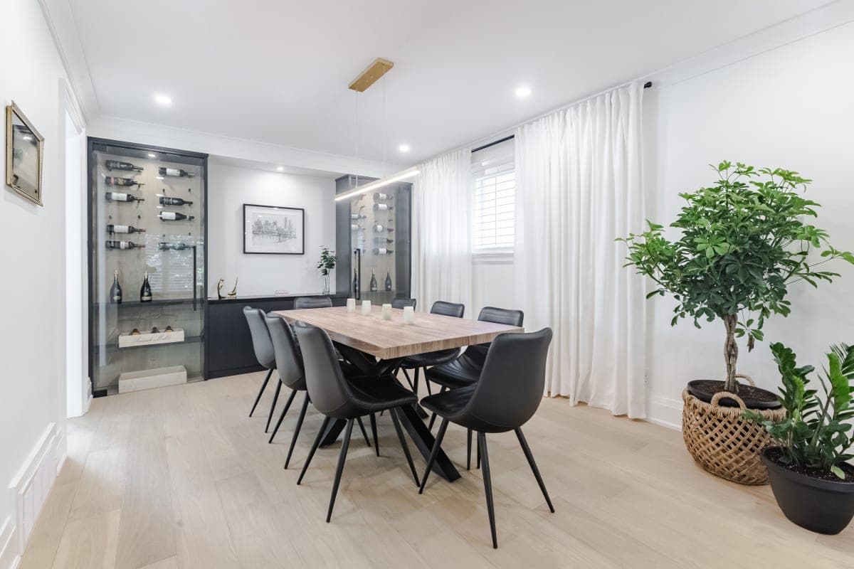 Formal dining room renovation with wainscoting and new lighting