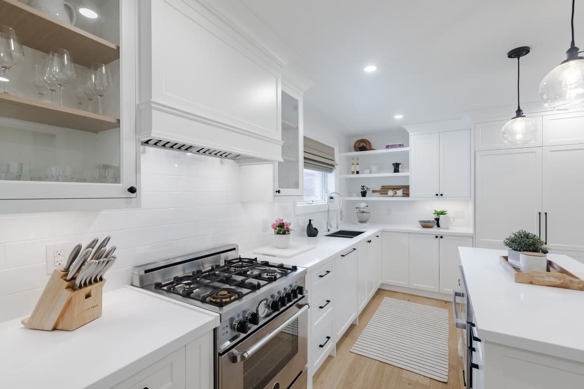 Custom kitchen redesign with island and recessed lighting