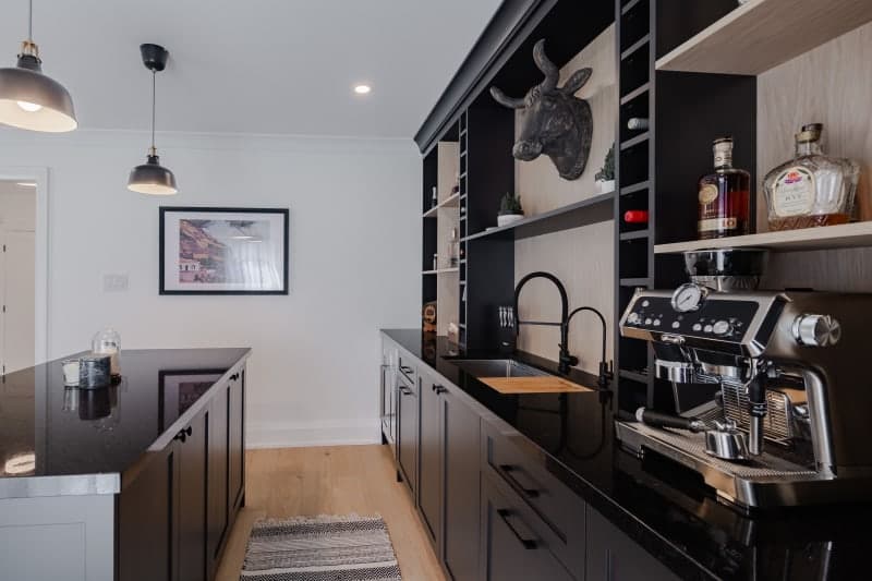 Built-in home bar with wine rack and under-cabinet lighting