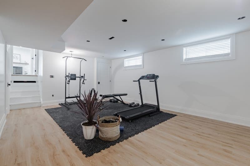 Basement home gym renovation with custom storage